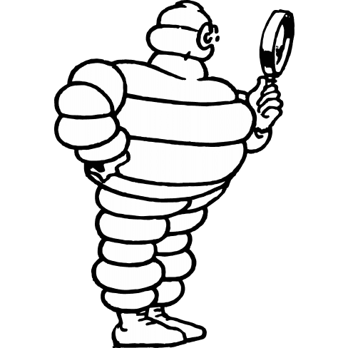 The Michelin Man looks through a magnifying glass