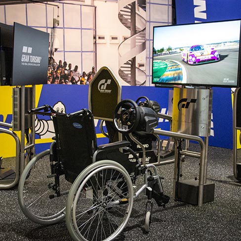 Wheelchair in front of the Gran Turismo game