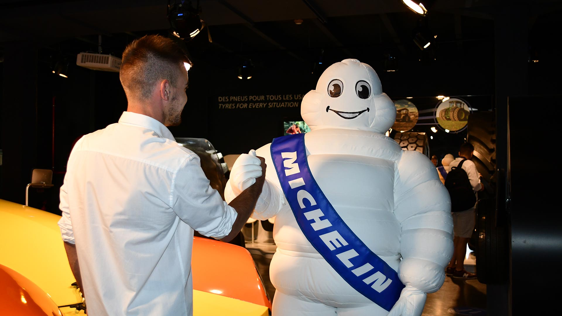 Visitor shaking hands with the Michelin Man